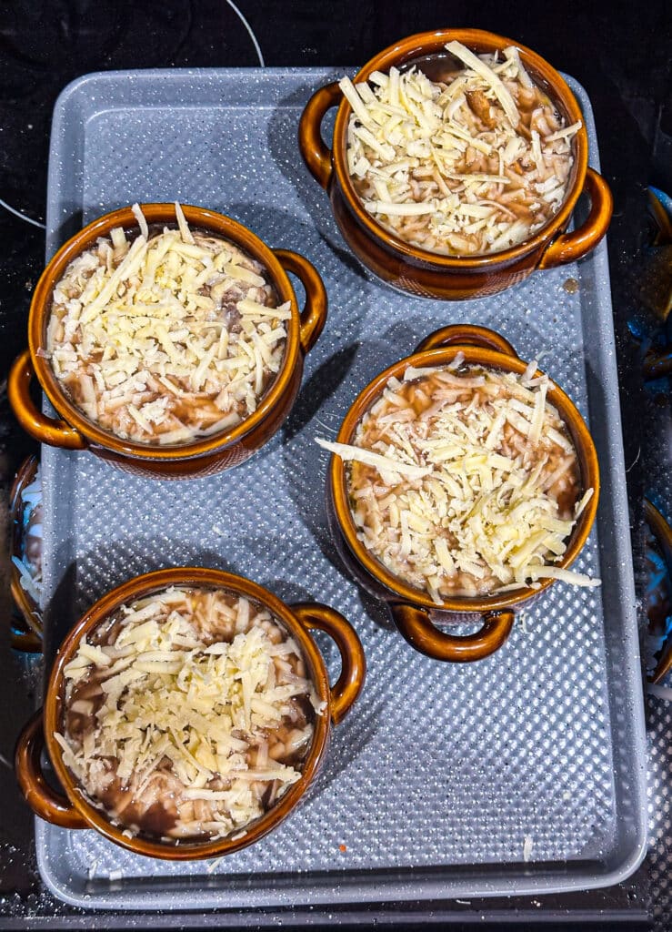 French onion soup with cheese before broiling