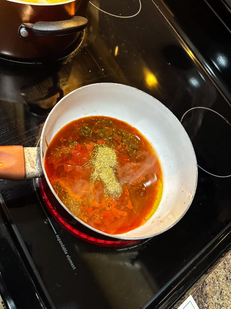 Making the sauce: reserved pasta water. tomato paste, veggie stock concentrate, marinara, Tuscan Heat Spice, and extra virgin olive oil