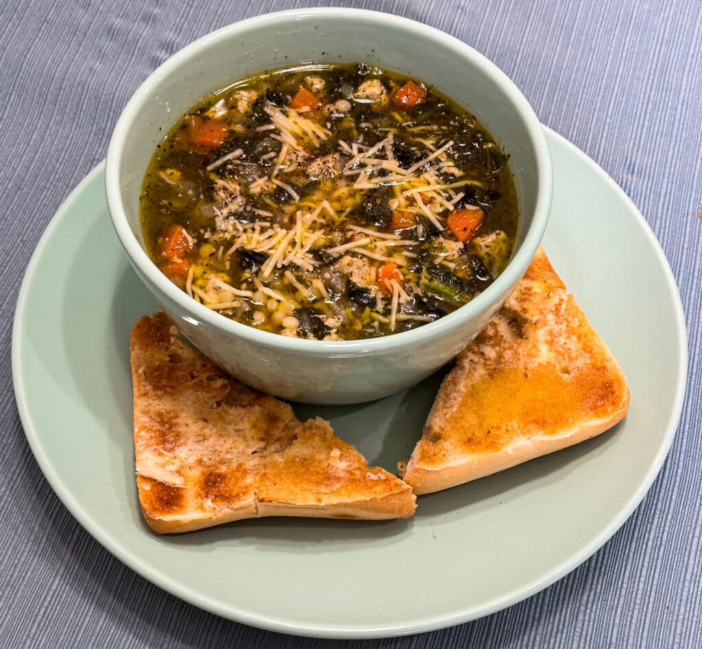 One-Pot Chicken Sausage & Kale Soup with parmesan cheese and garlic ciabatta toast