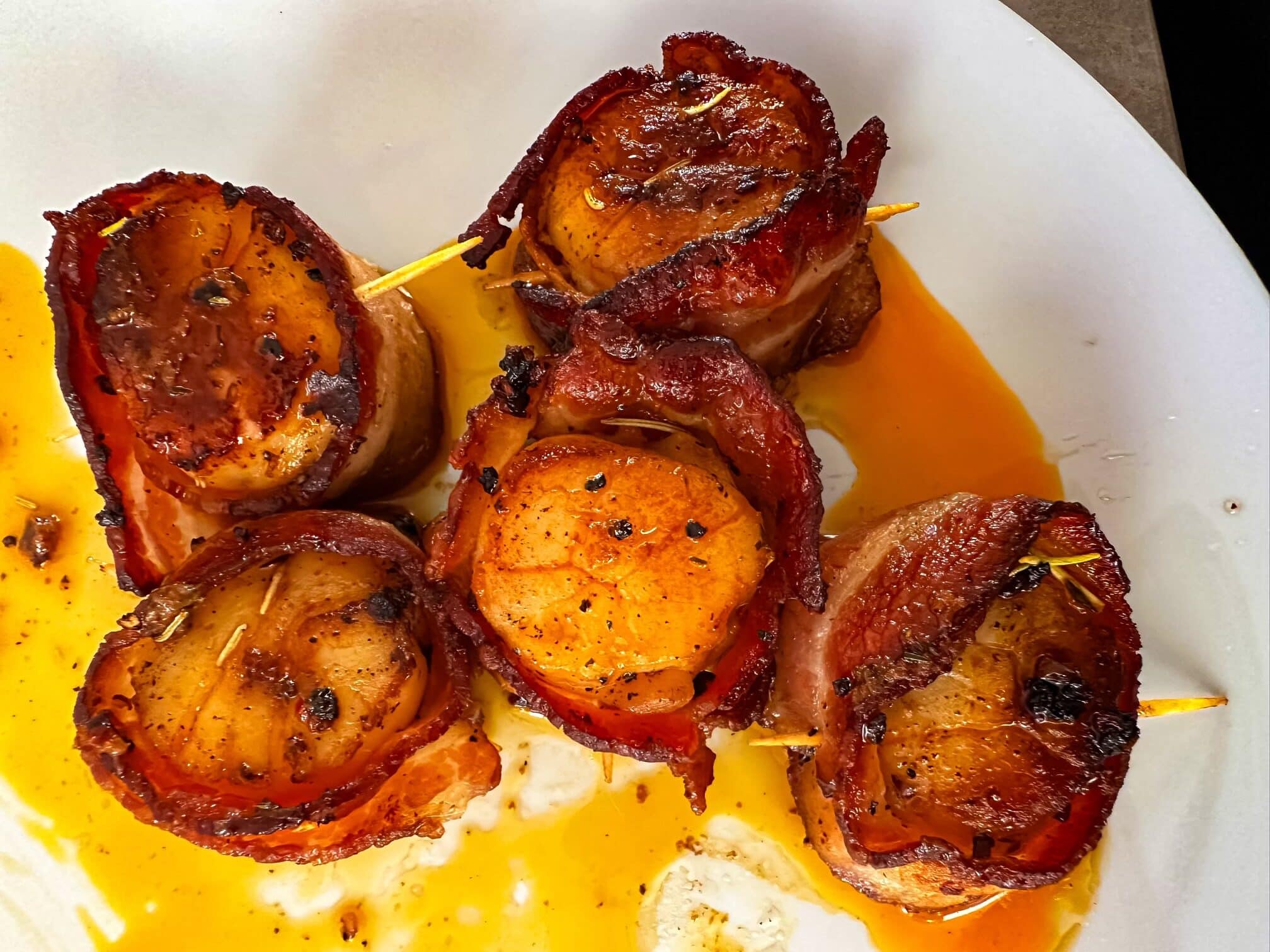 Bacon wrapped scallops with cowboy butter