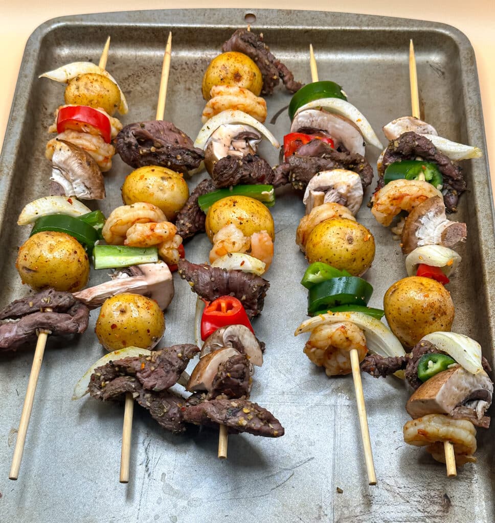 Prepped steak and shrimp shish kabobs