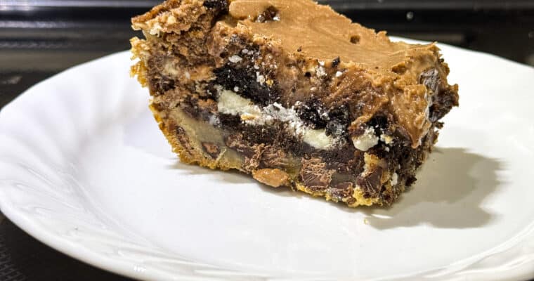 Oreo-Stuffed Brownie Cheesecake Bars